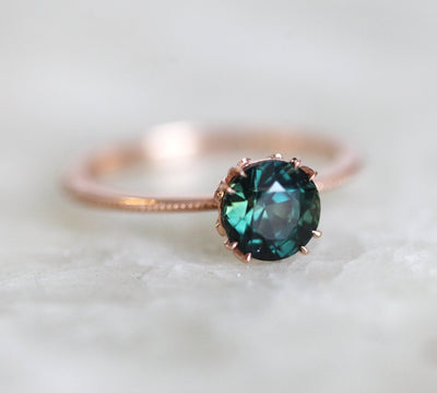 Round blue green solitaire sapphire ring