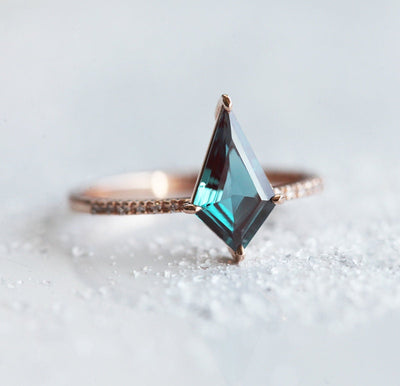 Teal Kite Alexandrite Engagement Ring with Round White Diamonds Nestled in the Band