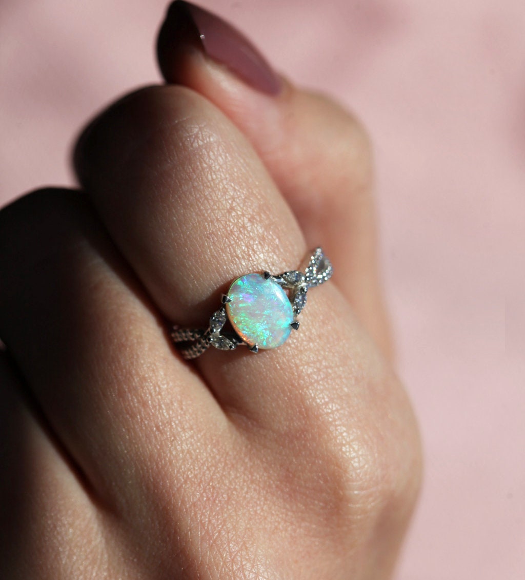 Green Blue Oval Opal Ring with Side Marquise-Cut and Round Diamonds along with Pave Style Band