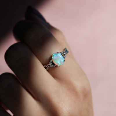 Green Blue Oval Opal Ring with Side Marquise-Cut and Round Diamonds along with Pave Style Band