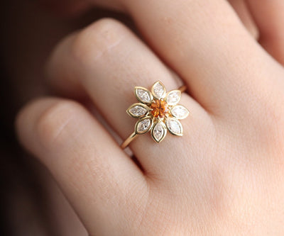 Orange round sapphire ring with diamond halo