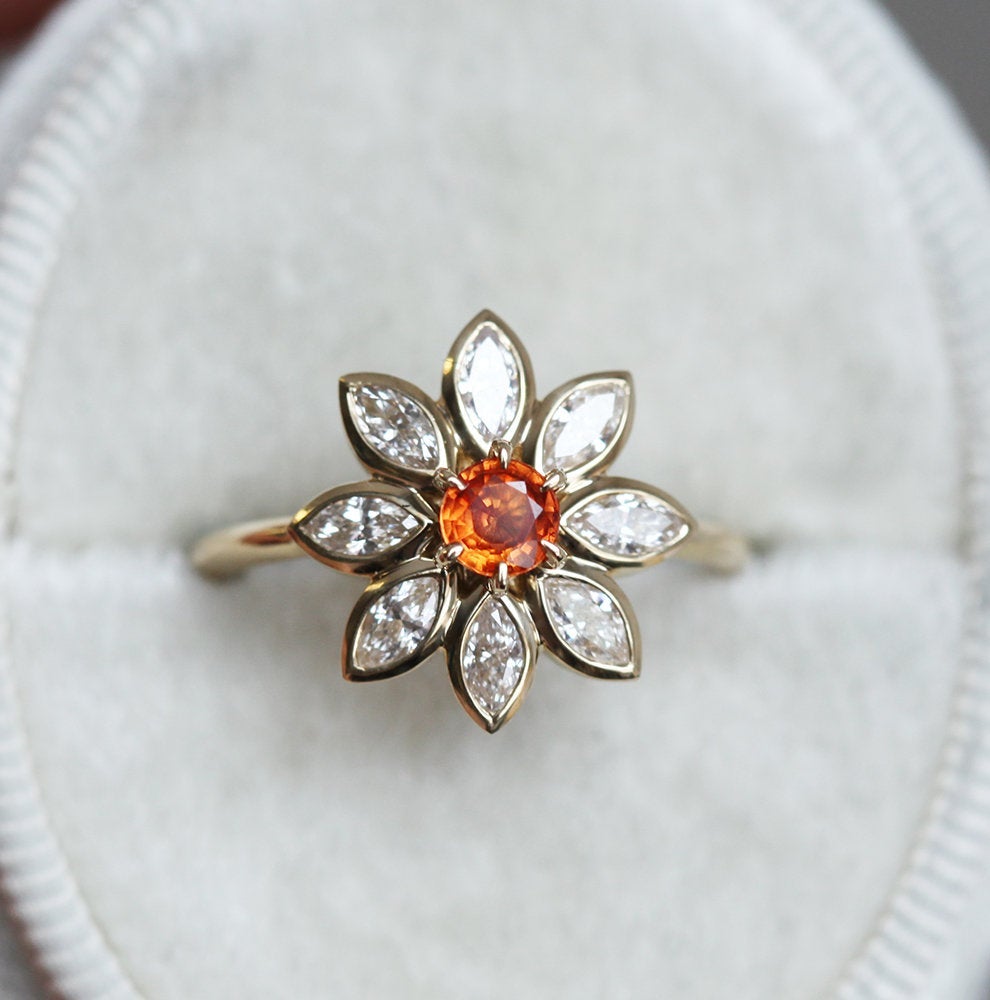 Orange round sapphire ring with diamond halo