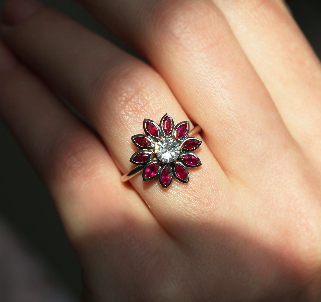 Round white sapphire floral ring with side rubies