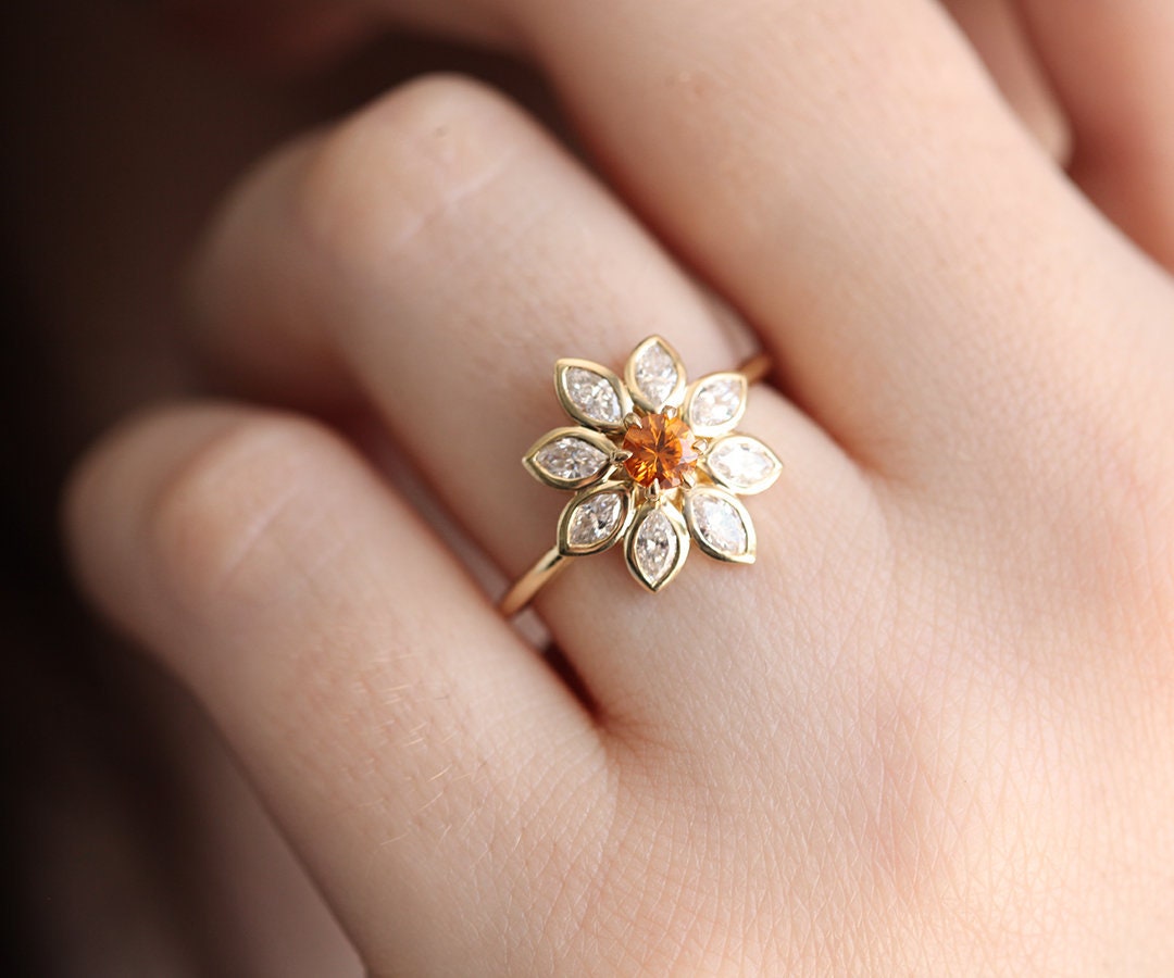 Round white sapphire floral ring with side rubies