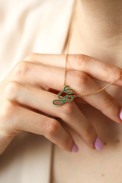 Turquoise Inlay Gold Necklace with Gemstone in the shape of the letter 'G'