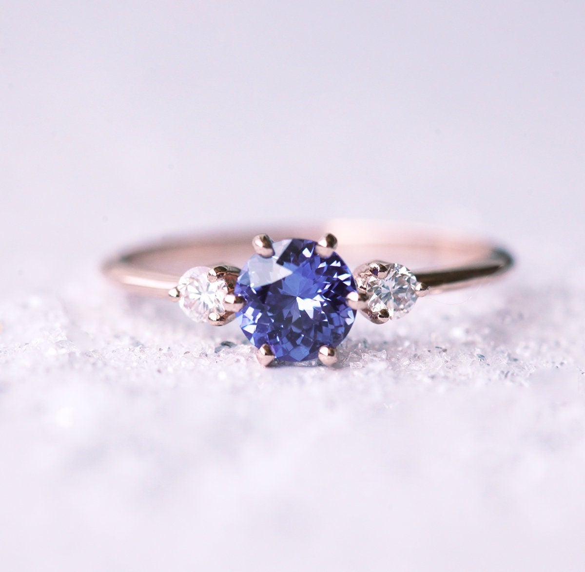 Round blue purple sapphire ring with side diamonds