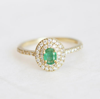 Oval white diamond engagement ring with diamond halo