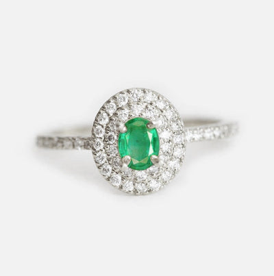 Oval white diamond engagement ring with diamond halo