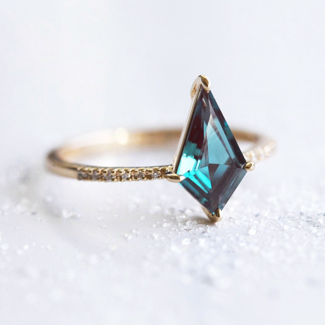 Teal Kite Alexandrite, Yellow Gold Engagement Ring with Round White Diamonds Nestled in the Band