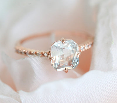 Radiant white sapphire ring with side diamonds