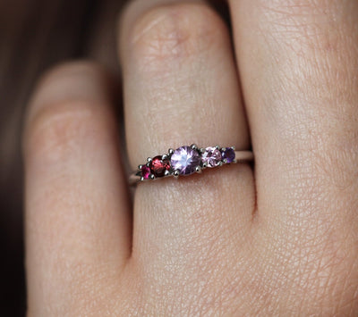 Purple round sapphire cluster ring with amethyst, rhodolite garnet and ruby stones