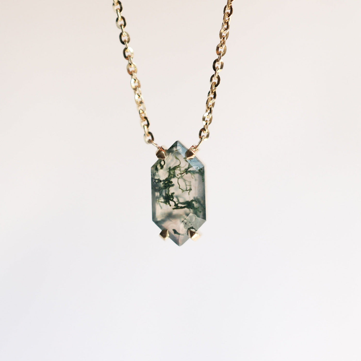 Gold chain necklace with hexagon-cut green moss agate stone