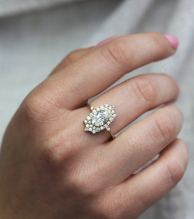 Oval White Diamond Halo Ring with lots of side White Diamonds