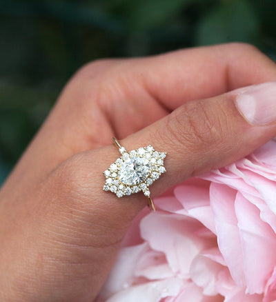 Oval White Diamond Halo Ring with lots of side White Diamonds