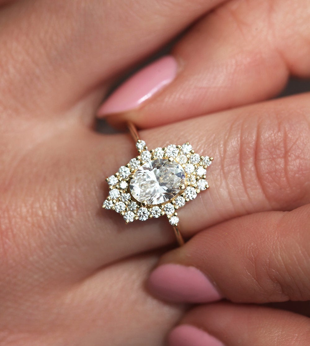 Oval White Diamond Halo Ring with lots of side White Diamonds