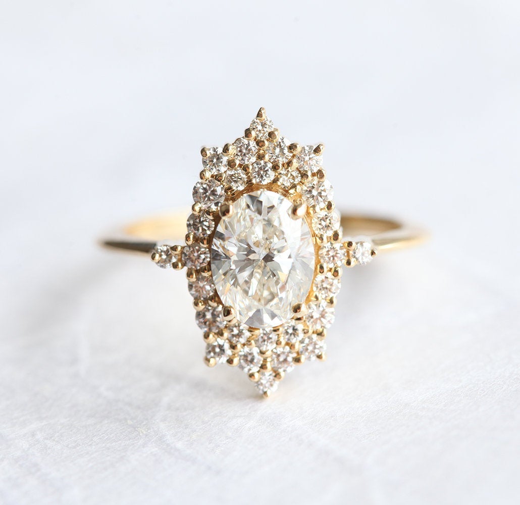 Oval White Diamond Halo Ring with lots of side White Diamonds