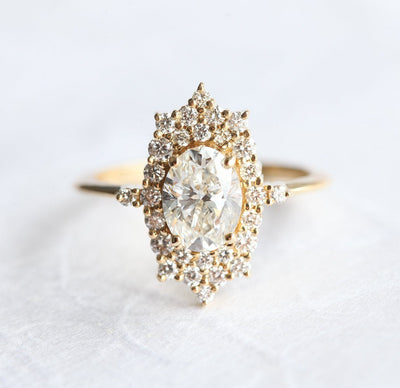 Oval White Diamond Halo Ring with lots of side White Diamonds