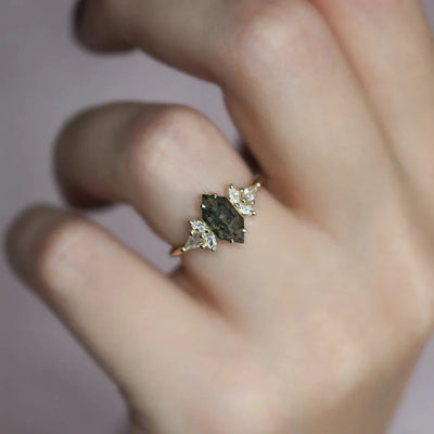 A modern hexagon-cut Moss Agate engagement ring with white diamond accents.