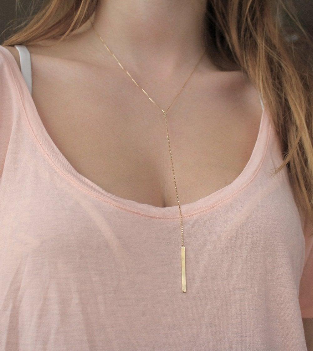 Gold lariat necklace with gold drop bar