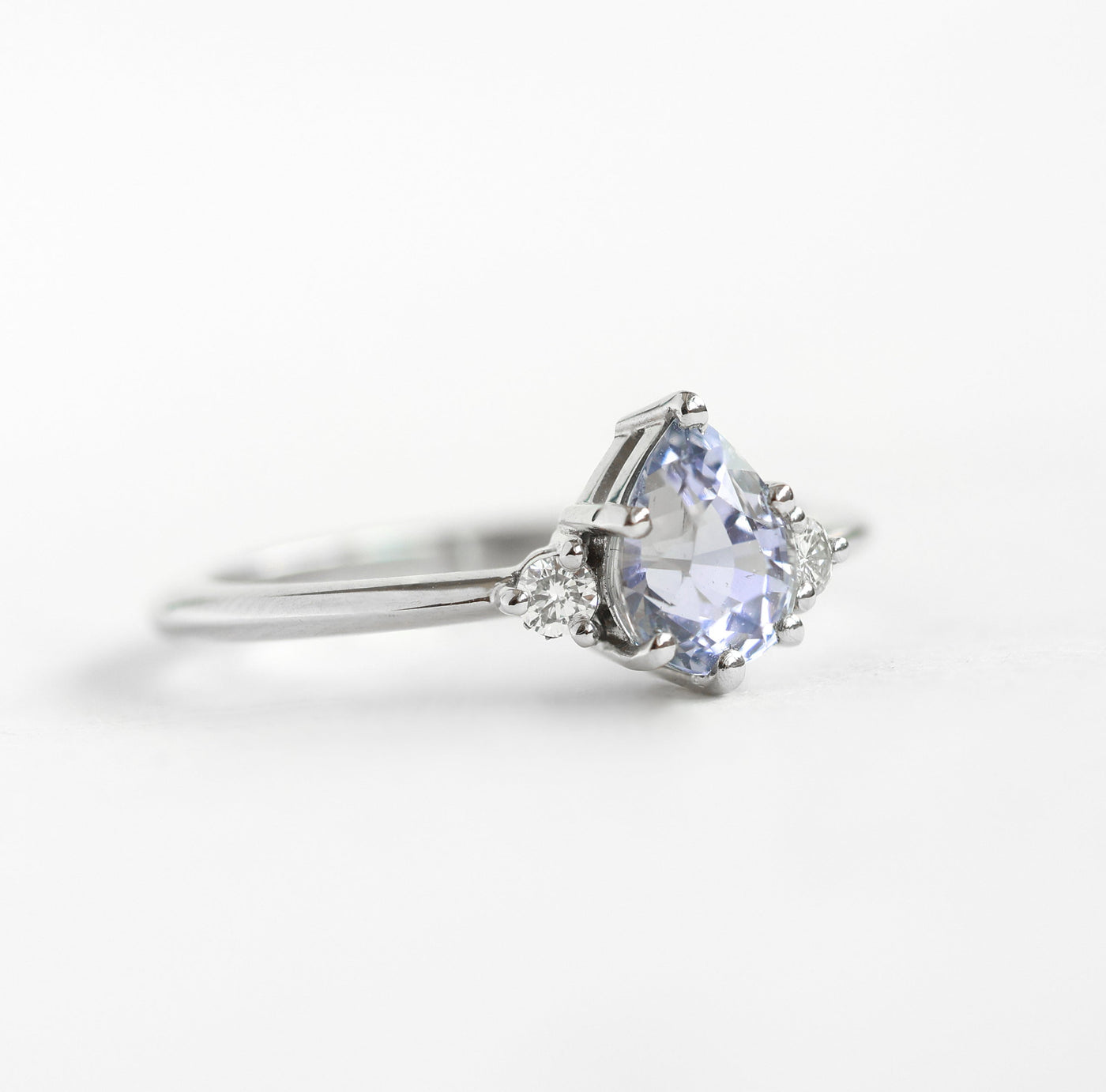 Pear-shaped lavender sapphire ring with side diamonds
