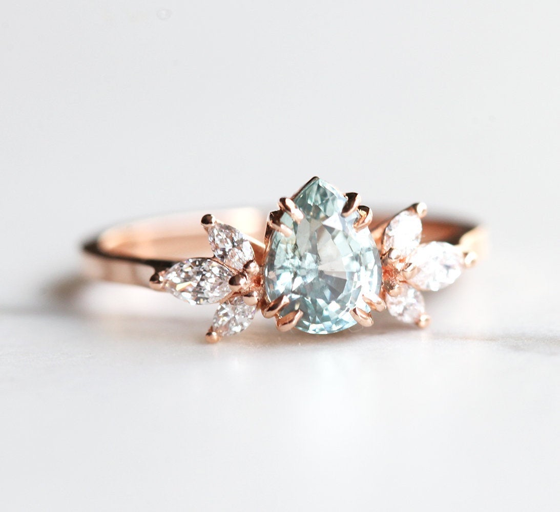 Pear-shaped sapphire ring with side diamonds