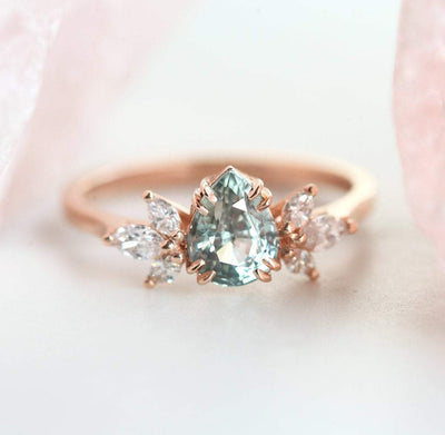 Pear-shaped sapphire ring with side diamonds