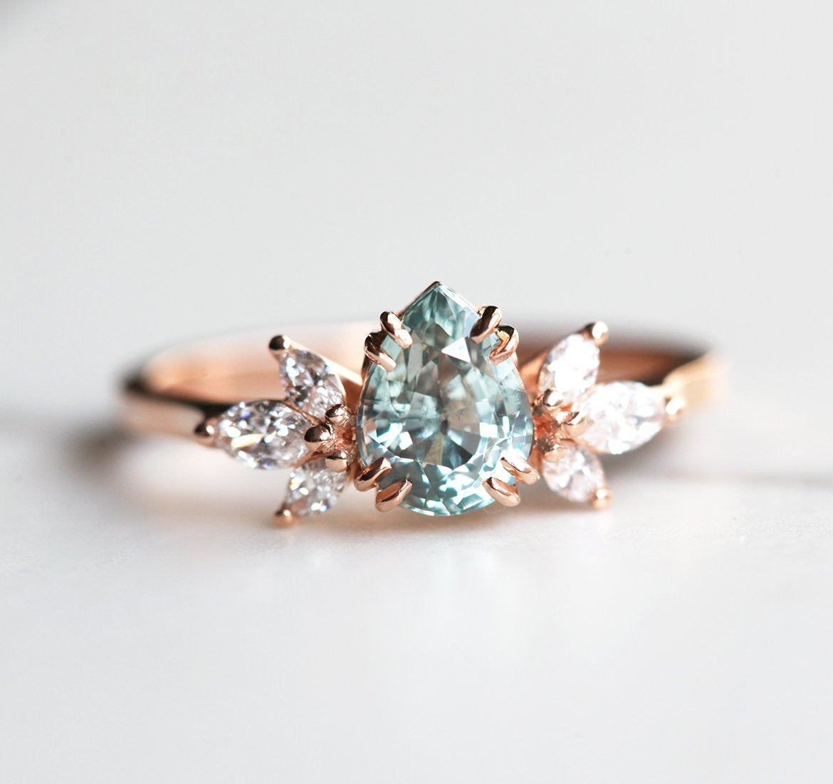 Pear-shaped sapphire ring with side diamonds