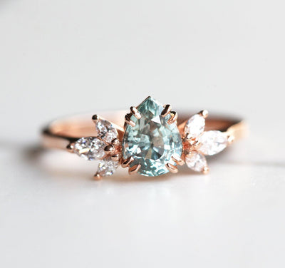 Pear-shaped sapphire ring with side diamonds