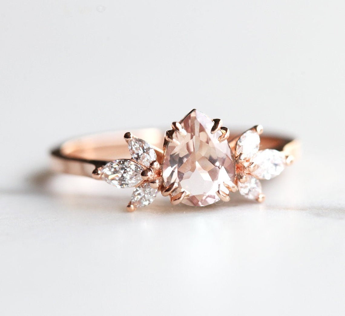 Pear-shaped pink ceylon sapphire ring with diamond cluster