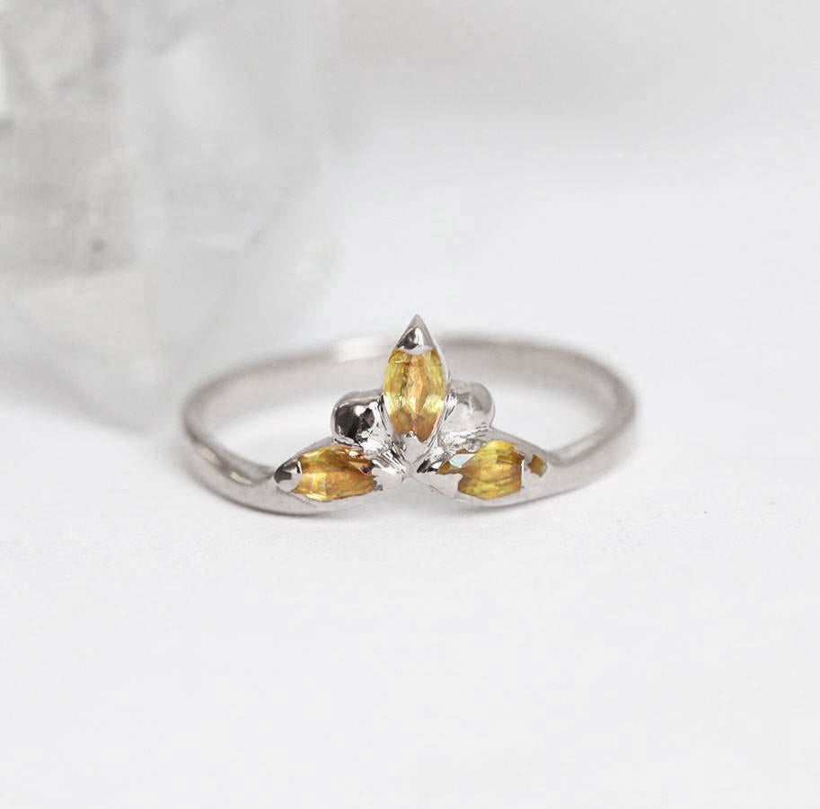 Marquise-cut yellow sapphire with side sapphires