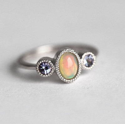Three-Stone Oval Opal Ring with 2 Side Round Tanzanite Gemstones