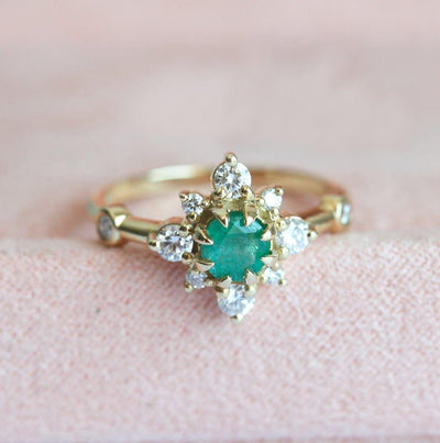 Vintage-inspired Emerald Ring in 14k yellow gold with green emerald and diamonds.