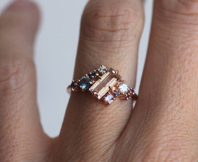 Pink baguette-cut morganite engagement ring set with diamond, sapphire and amethyst gemstones in asymmetric wave shape