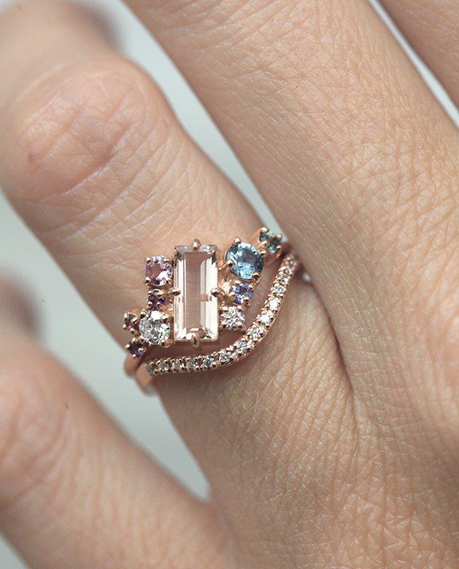 Pink baguette-cut morganite engagement ring set with diamond, sapphire and amethyst gemstones in asymmetric wave shape