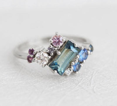 Baguette-shaped blue sapphire ring with diamond, amethyst and sapphire cluster