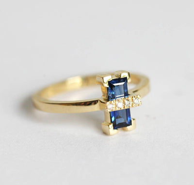 Baguette-shaped blue sapphire ring with white side diamonds