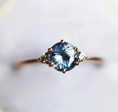 Round blue sapphire ring with side diamonds