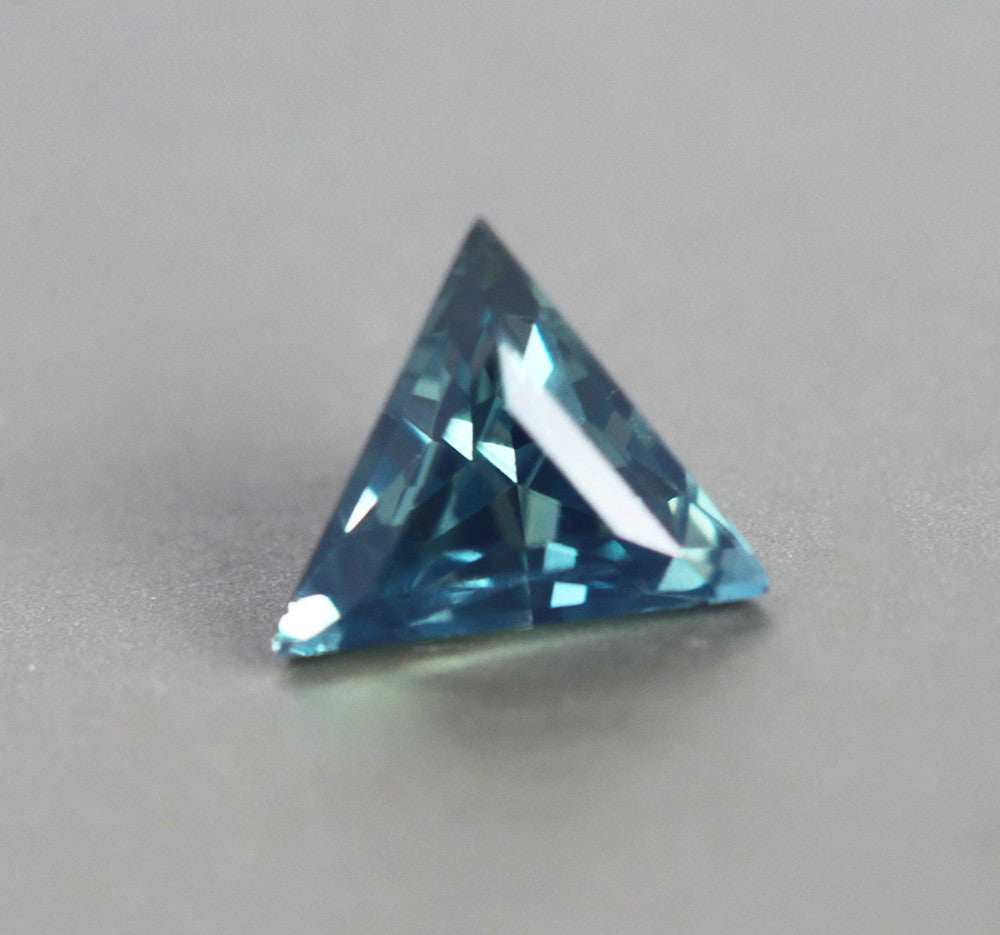 Loose triangle-cut teal sapphire
