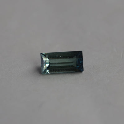 Loose rectangle-shaped teal sapphire