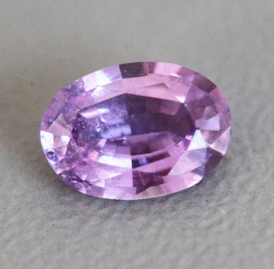 Loose oval-shaped purple sapphire