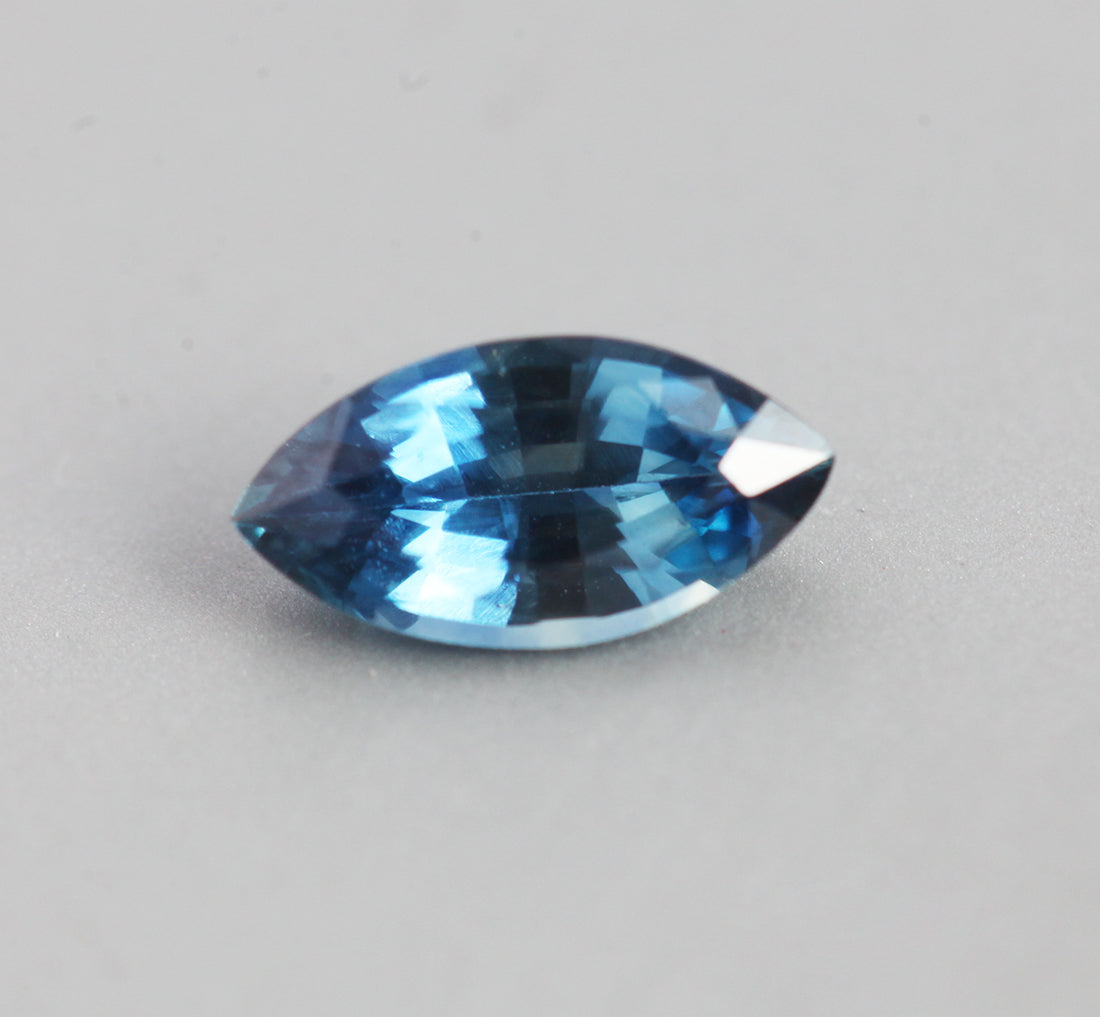 Loose marquise-cut teal sapphire