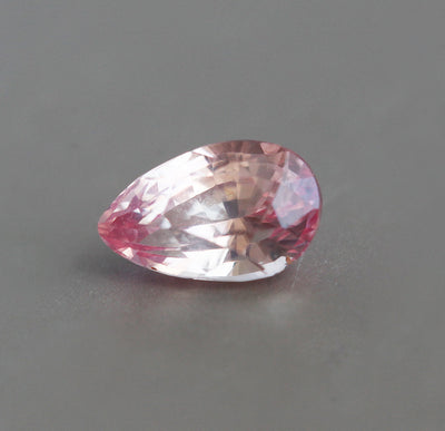 Loose pear-shaped pink and orange sapphire