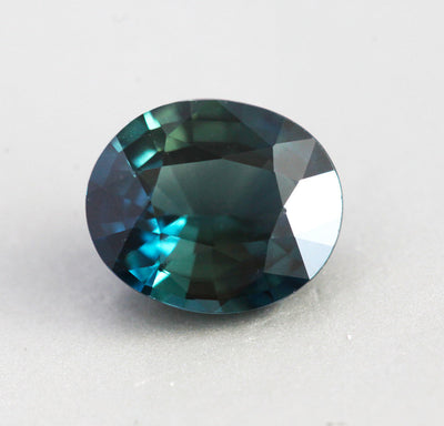 Loose oval-shaped teal sapphire