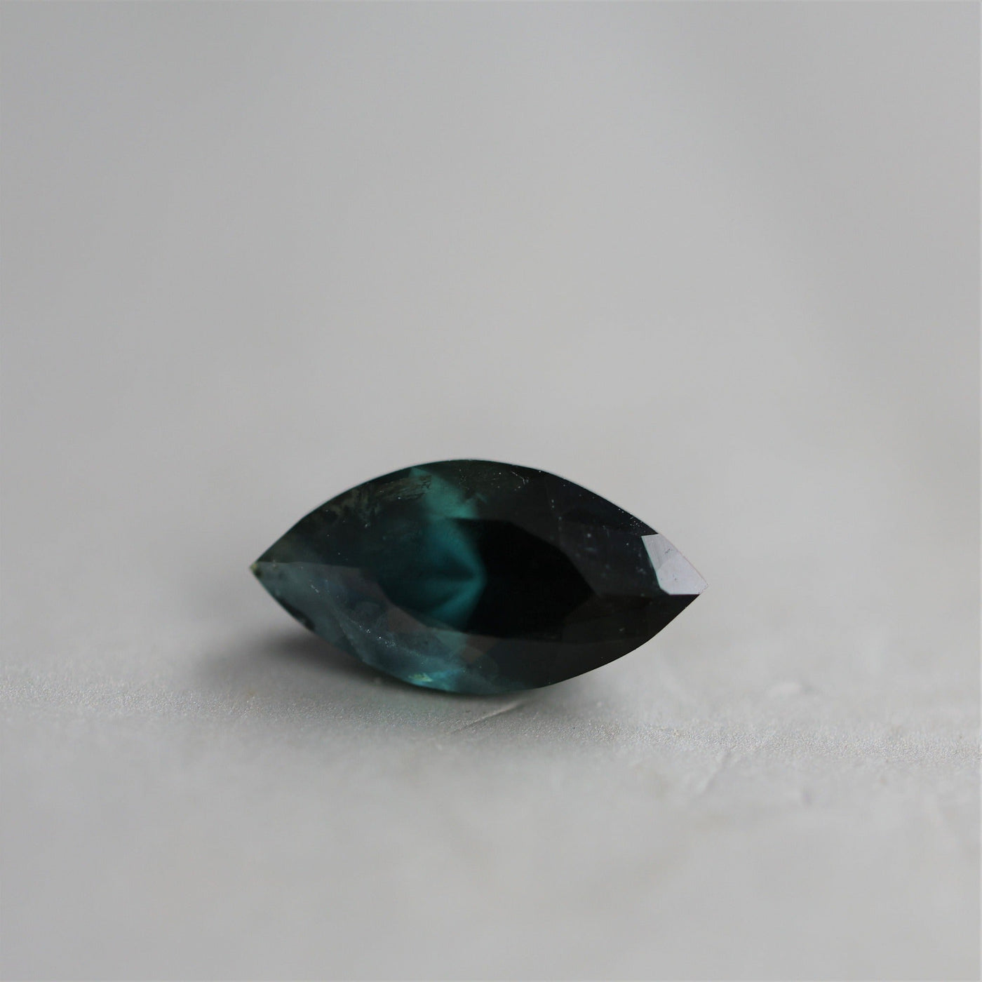 Loose marquise-cut teal sapphire