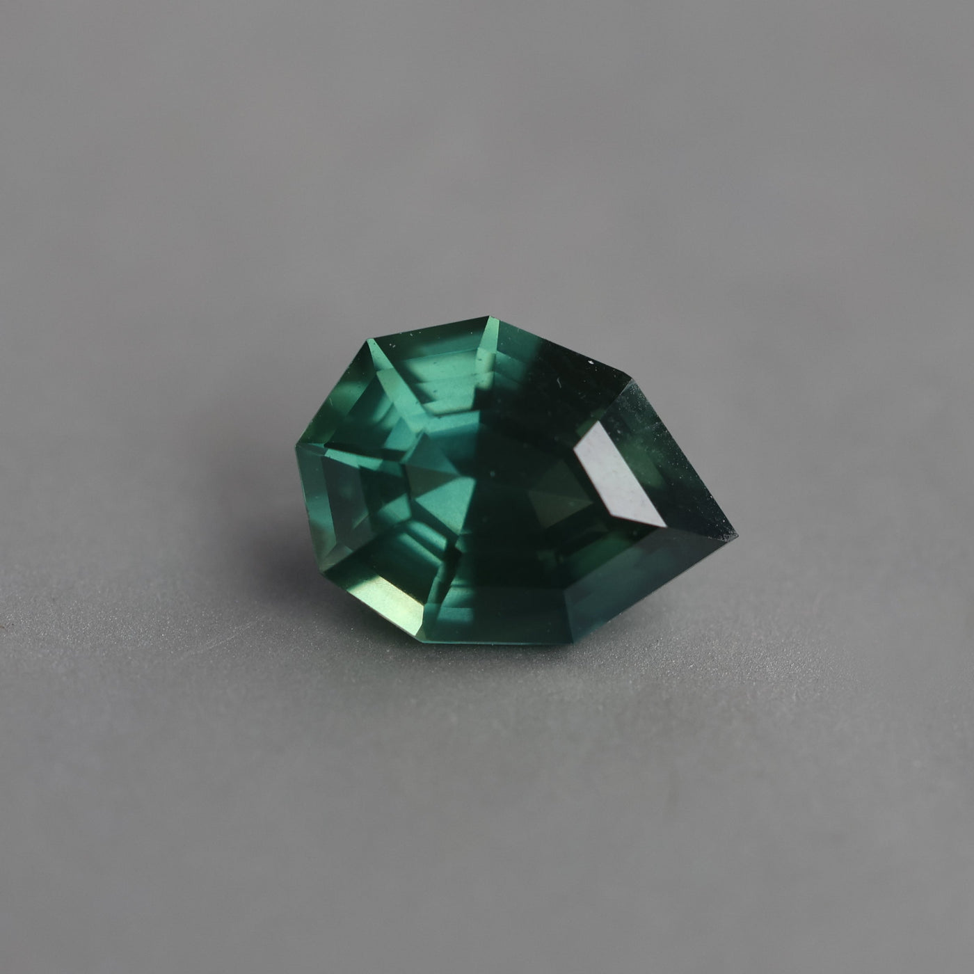 Loose pear-shaped teal sapphire