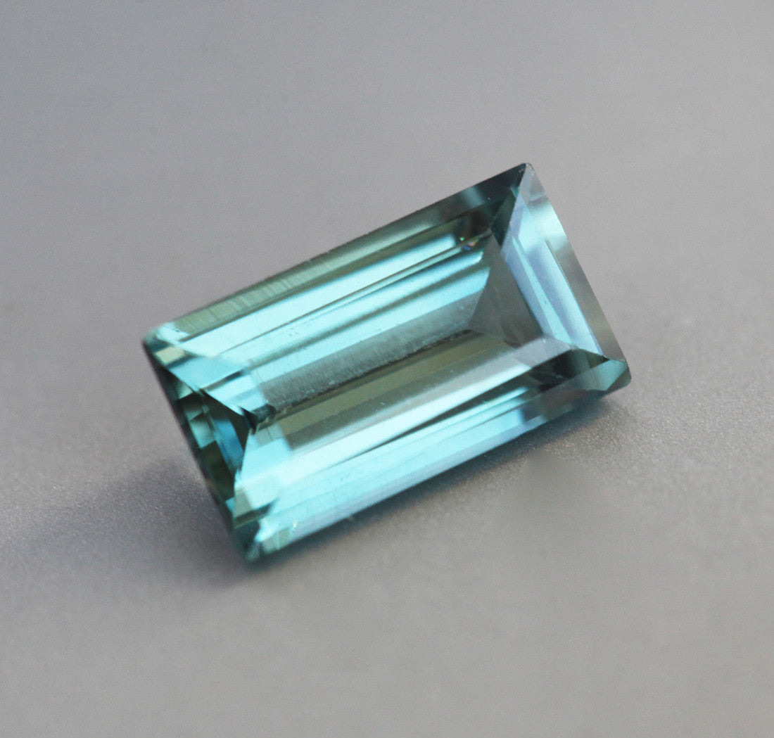 Loose rectangle-shaped teal sapphire