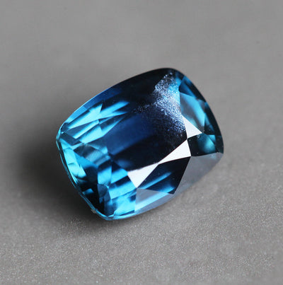 Loose cushion-cut dark blue sapphire