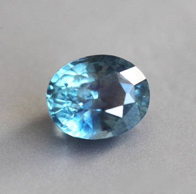 Loose oval-shaped teal sapphire