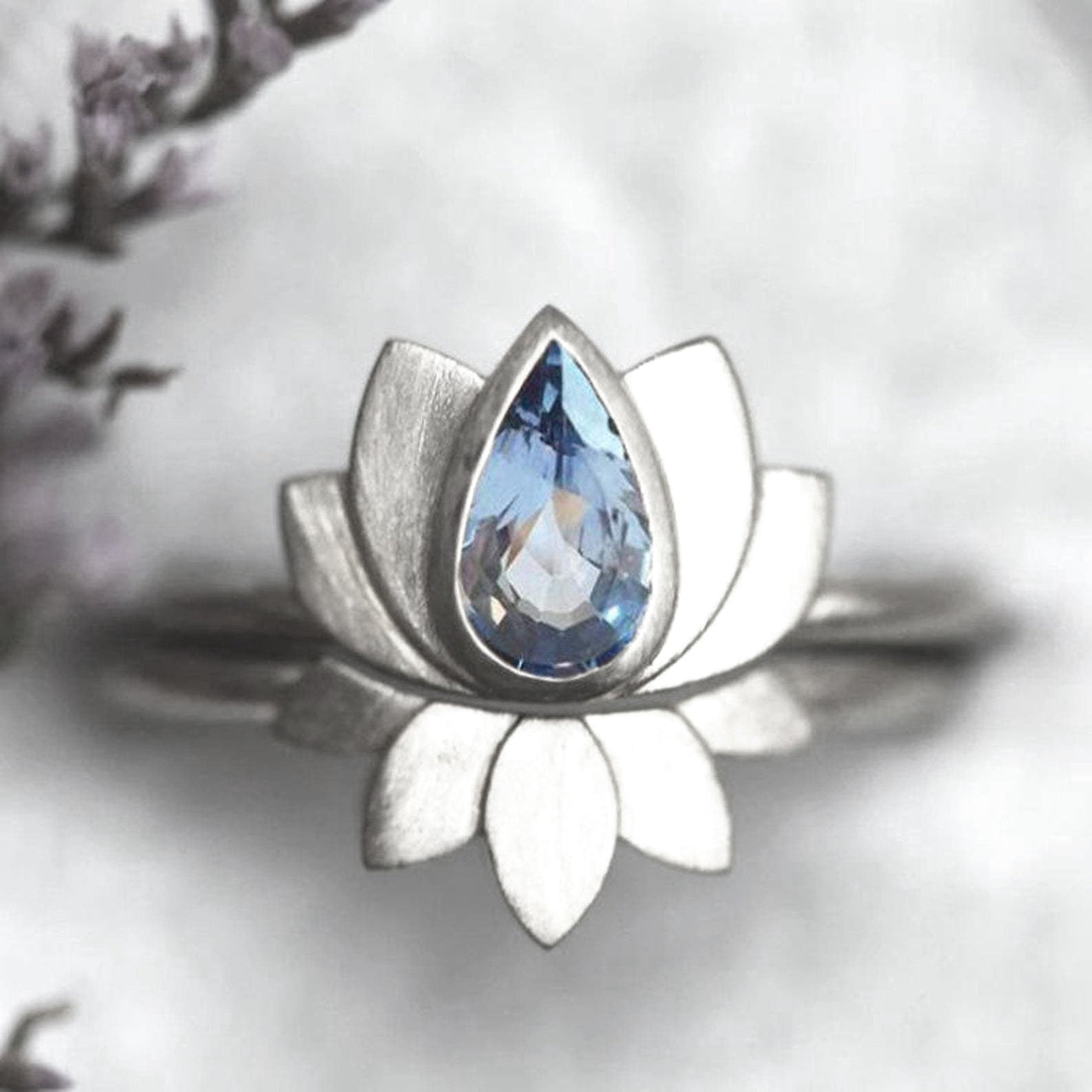Pear-shaped blue sapphire lotus ring