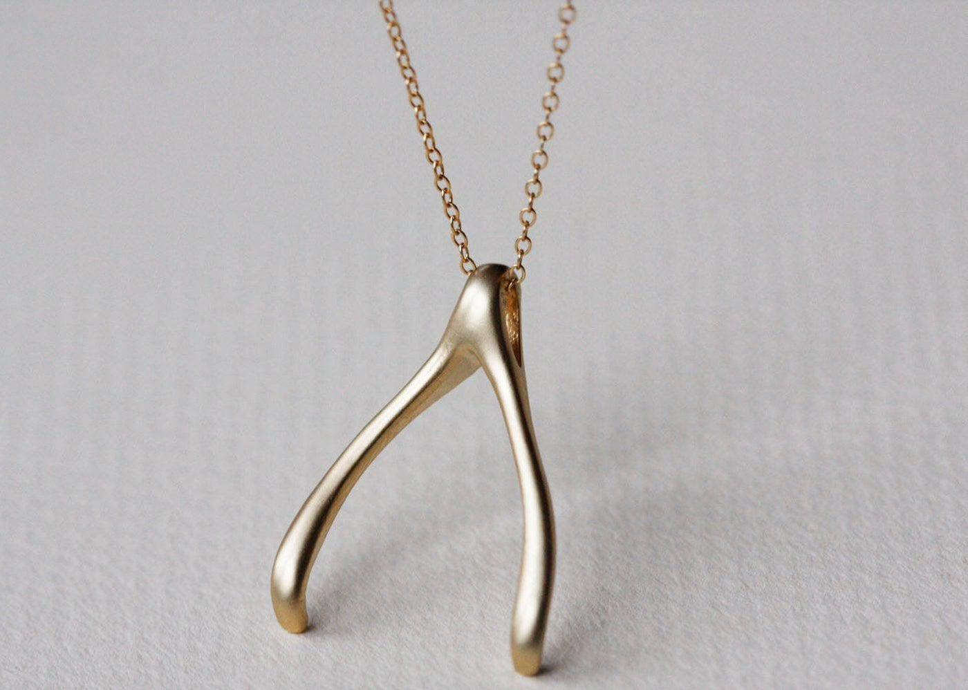 Gold wishbone necklace